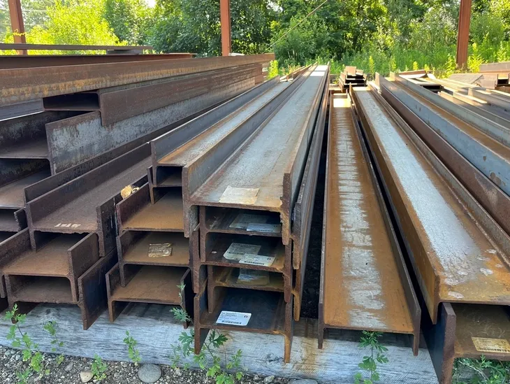Steel beams stacked outdoors
